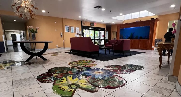 Bright lobby area with colorful floral tile design