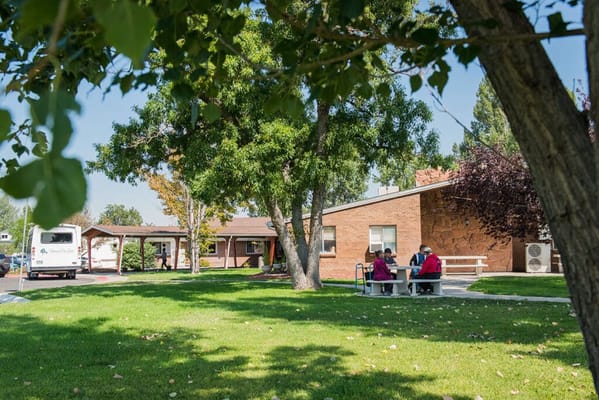 Residents enjoying a picnic in the facility's garden