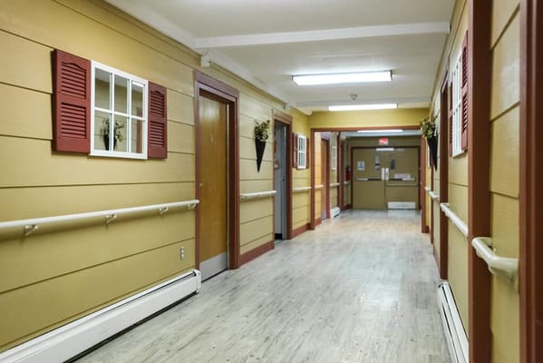 Brightly lit hallway in a senior living facility