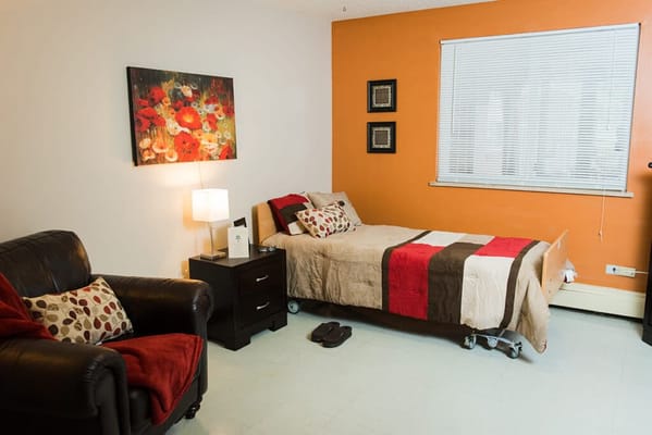 Cozy interior room with a bed and armchair