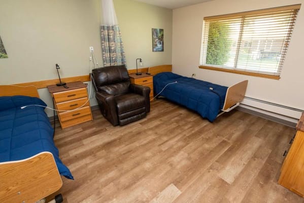 Interior view of a shared bedroom with two beds