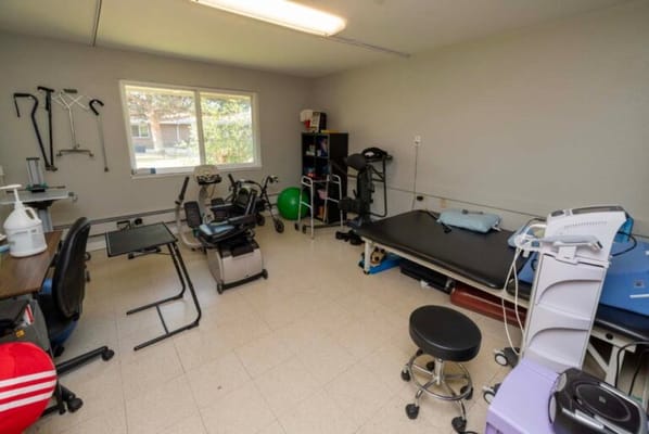 Therapy room with equipment and exercise tools