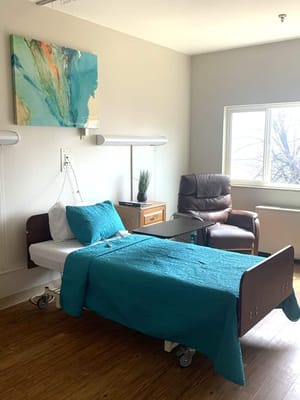 Cozy interior of a resident's room with a hospital bed