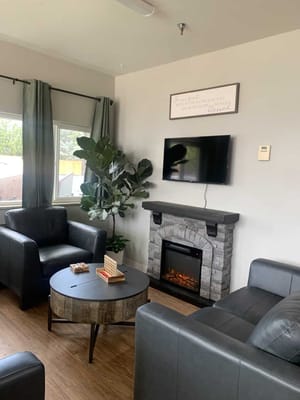 Cozy common area with comfortable seating and fireplace