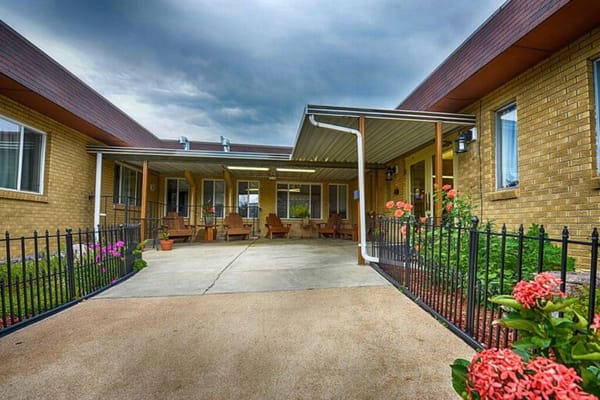 Outdoor seating area with flowers and canopy