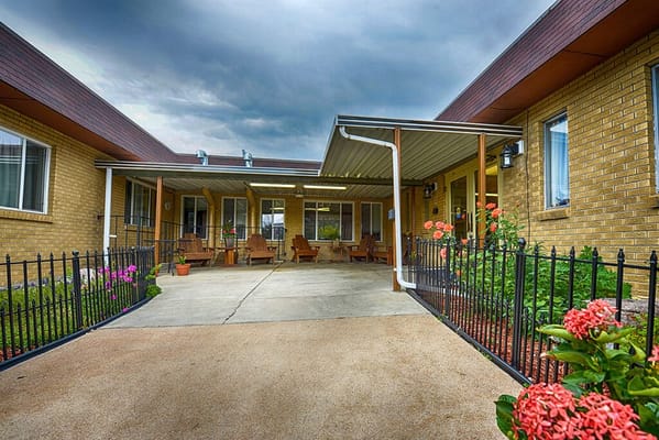 Outdoor seating area with flowers and canopy