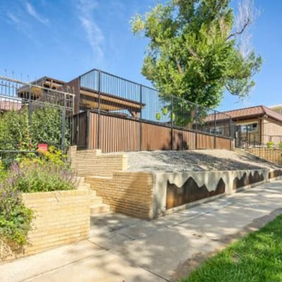 Exterior view of the facility with gardens and pathways