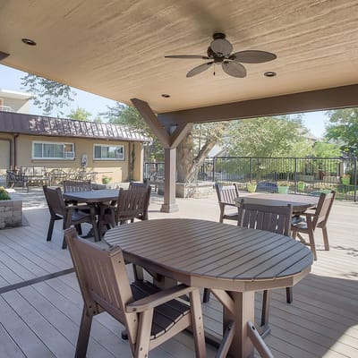 Outdoor seating area with tables and chairs