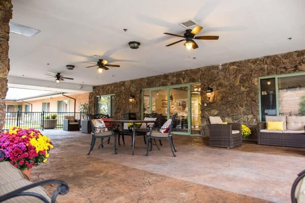 Seating area with flowers on a covered patio