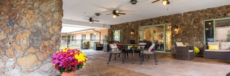 Cozy outdoor seating area with colorful flowers