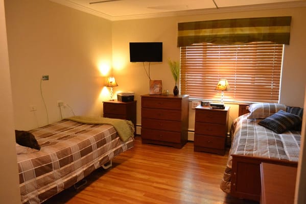Cozy shared bedroom in a senior living facility