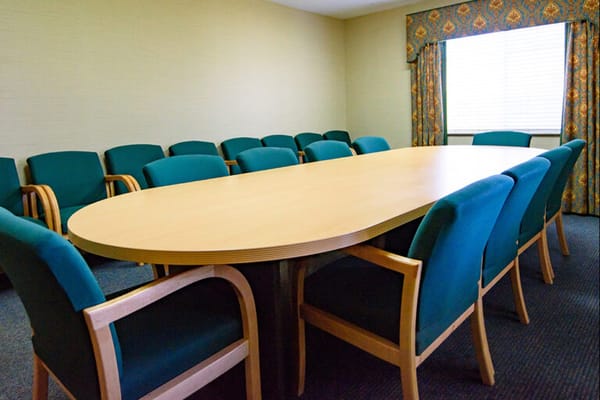 Meeting room with a large oval table and chairs