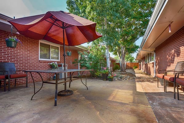 Outdoor patio area with seating and plants