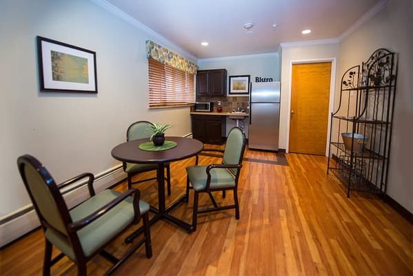 Cozy bistro area with a table and chairs