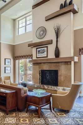 Cozy common area with seating and a fireplace