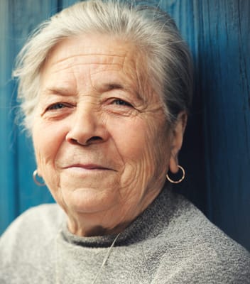 Close-up portrait of an elderly woman smiling
