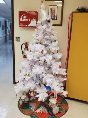 Decorated white Christmas tree in a common area
