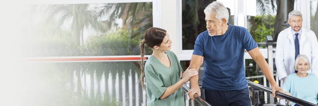 Caregiver assisting a resident in a facility