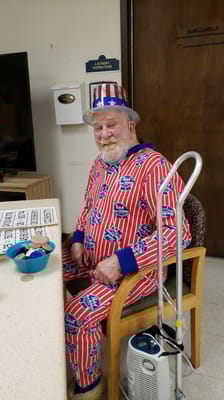 Resident in festive outfit playing bingo