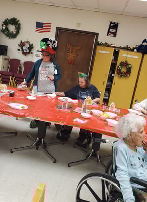 Residents enjoying a festive meal in the common area