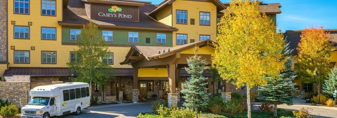 Exterior view of assisted living facility with landscaping