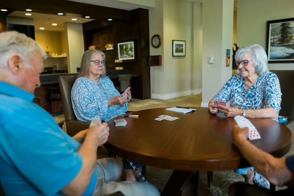 Residents playing cards in a common area
