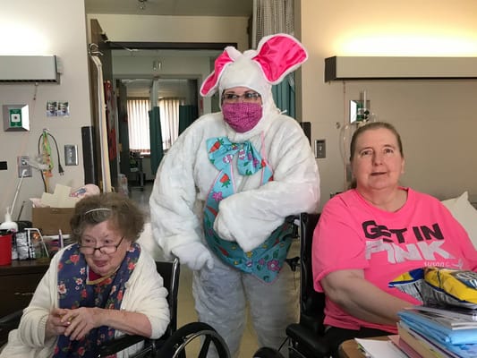 Residents enjoying a festive event with a costumed character