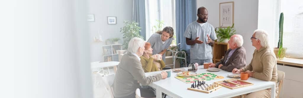 Residents engaging in games in a bright common area