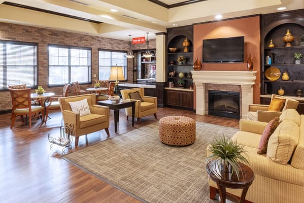 Cozy common area with seating and a fireplace