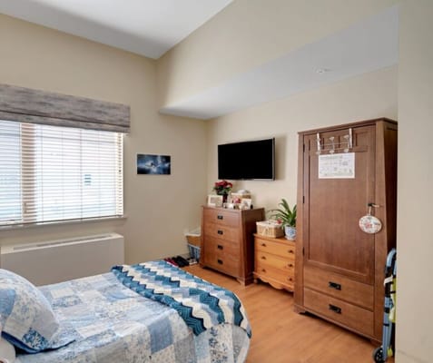 Brightly decorated bedroom in a senior living facility