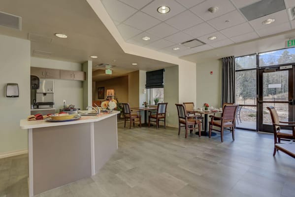 Bright common area with seating and light decor