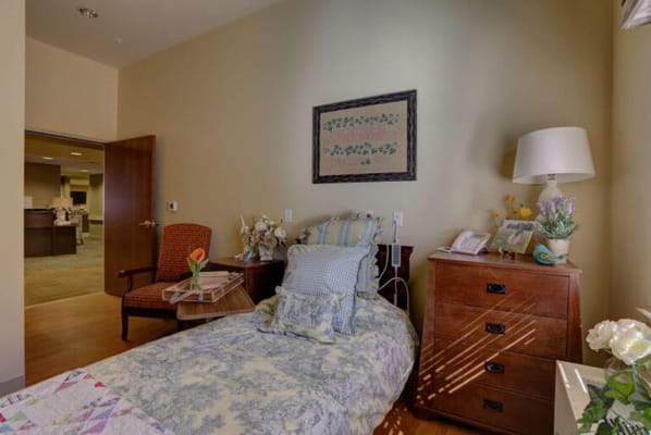 Cozy resident room with bed and personal decor