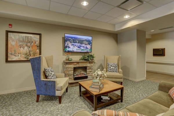 Cozy common area with chairs and a TV