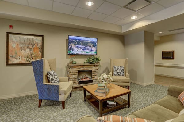 Cozy common area with chairs and a TV