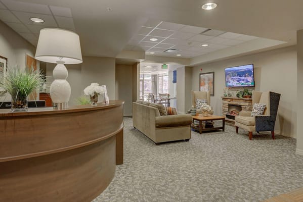 Bright common area with seating and plants