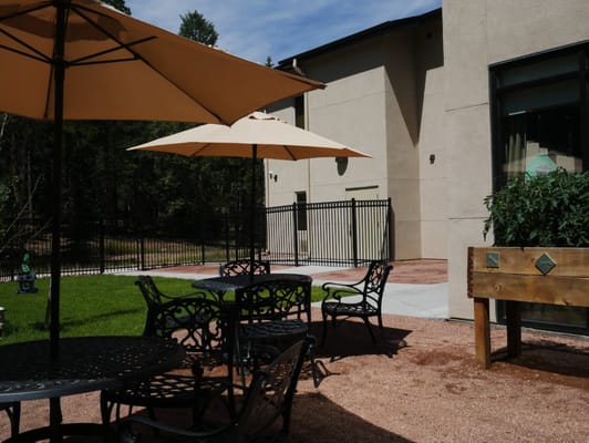 Outdoor seating area with umbrellas and tables