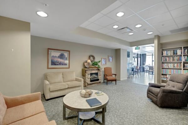 Common area with seating and a bookshelf