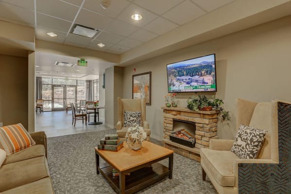 Interior common area with seating and a television