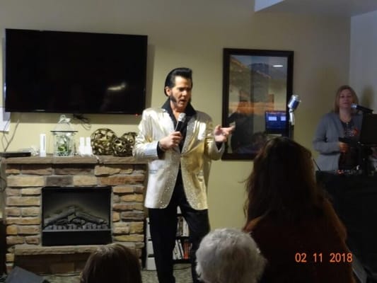A performer entertaining residents in a common area