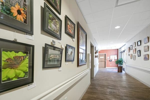 Interior hall with framed photographs on walls