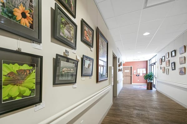 Interior hall with framed photographs on walls