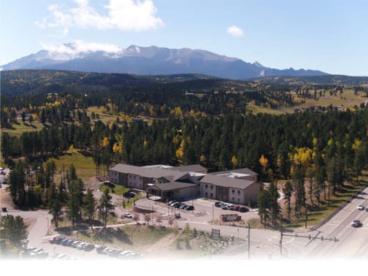 Aerial view of a senior living facility surrounded by nature