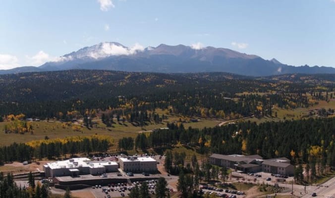 Aerial view of a senior living facility in a mountainous area