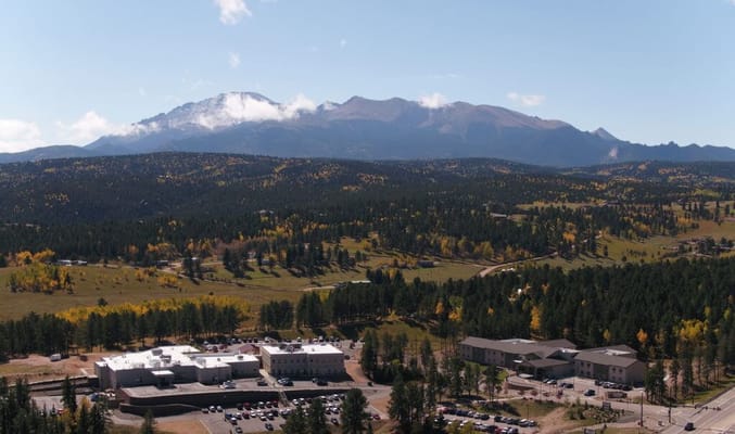 Aerial view of a senior living facility in a mountainous area