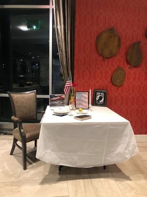 Set dining table with tablecloth and floral arrangement