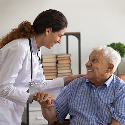 Healthcare professional interacting with an elderly resident