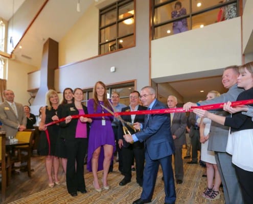 Ribbon cutting ceremony in a common area