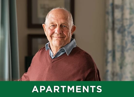 A senior man smiling in an apartment