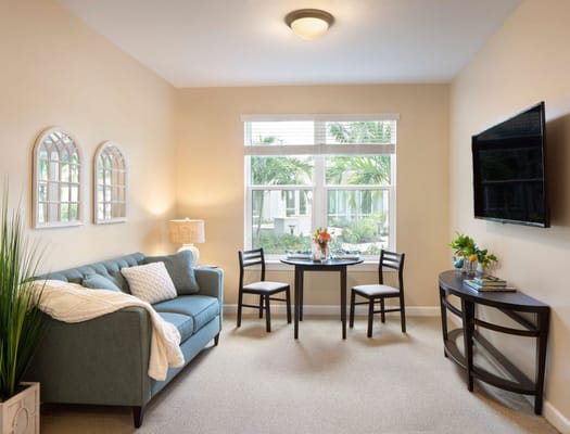 Bright interior room with a couch and table