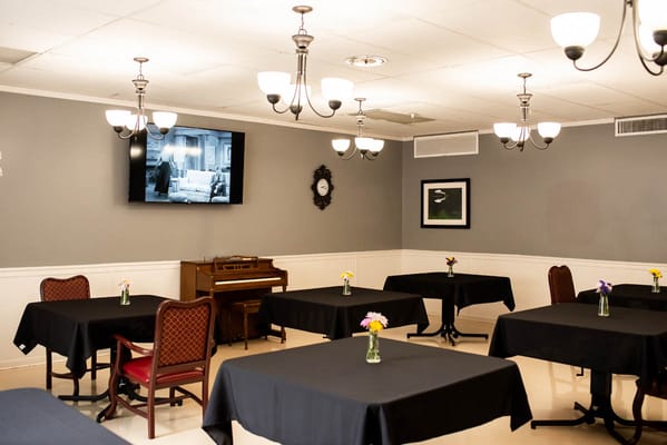 Common area with tables and flowers in vases